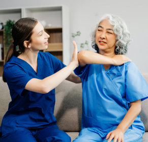 caregiver holding senior woman