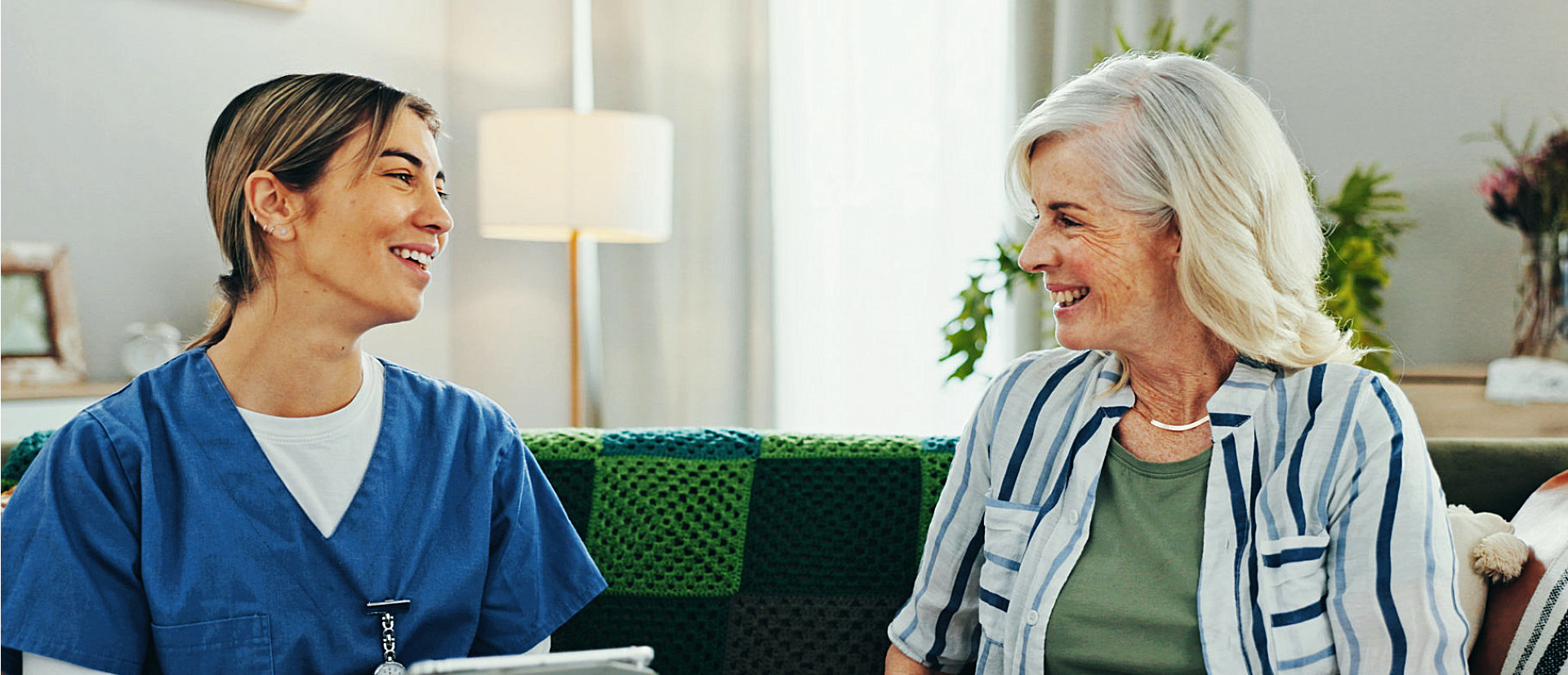 caregiver and senior woman talking