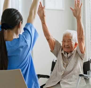 nurse doing exercise with elder
